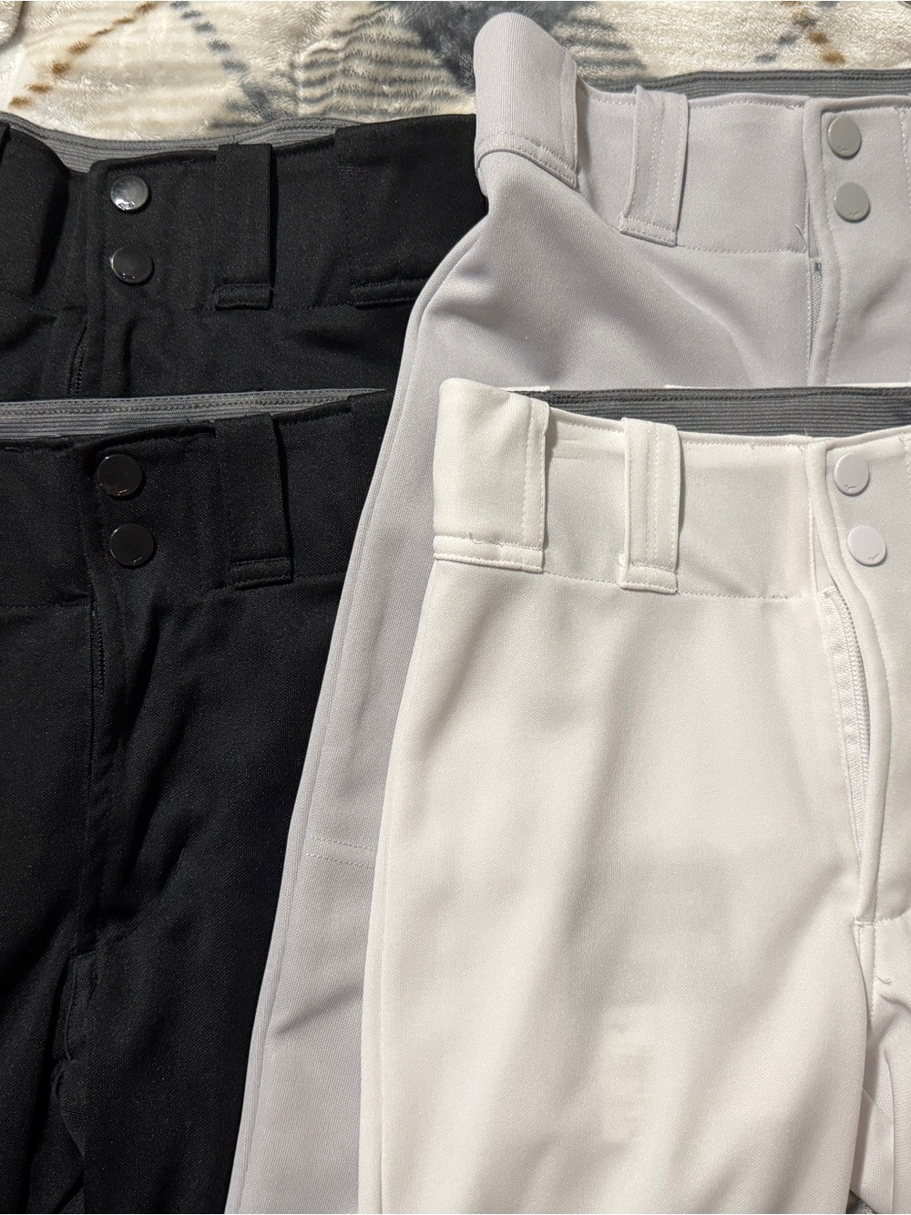 Girl’s Mizuno Prospect Softball Pants in Black, Light Gray, and White